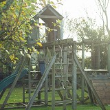 LARGE WOODEN PLAYFRAME WITH CHILD SWINGS AND SLIDE