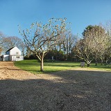GRAVEL DRIVE AND PARKING NEAR THE HOUSE